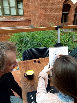 Artists drawing portraits