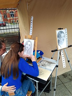 Artists signing portrait drawing