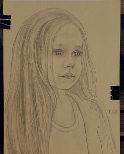 A girl portrait drawn in pencil bright blonde small